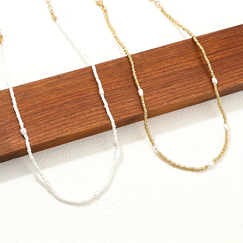ELARA | SET COLLANA A STRATI CON PERLE E PUNTI LUCE