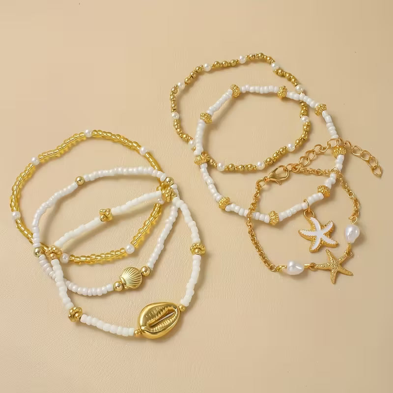 CORALIA | SET DI 6 BRACCIALETTI ORO COSTIERO E PERLE