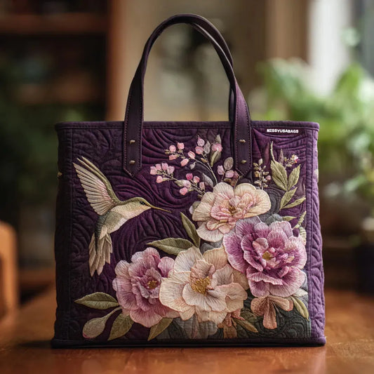 LILIAN | BORSA IMBOTTITA VIOLA FATTA A MANO CON COLIBRÌ E ORCHIDEE