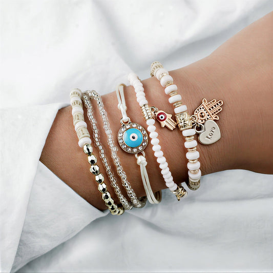 AMARA | SET DI BRACCIALI HAMSA ORO ELEGANTI