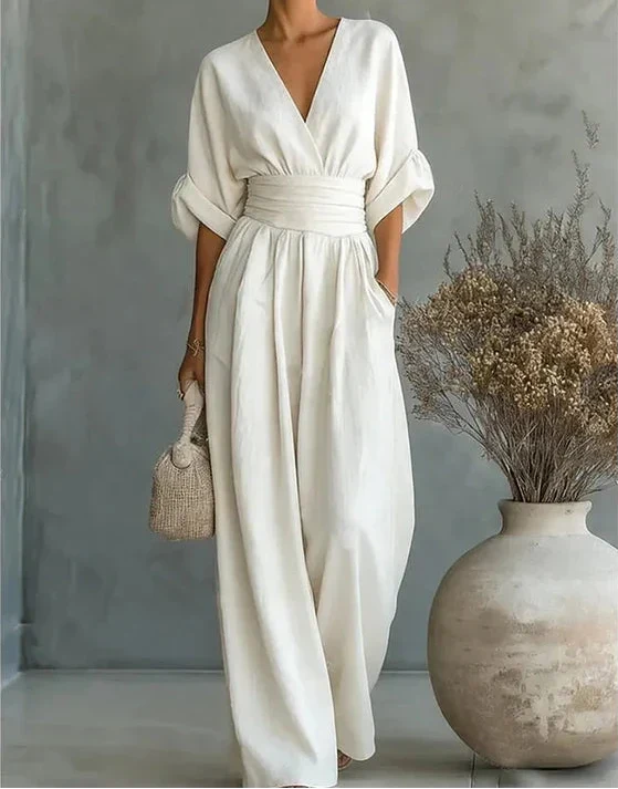 MONICA | ELEGANTE TUTA A GAMBA LARGA CON SCOLLO A V