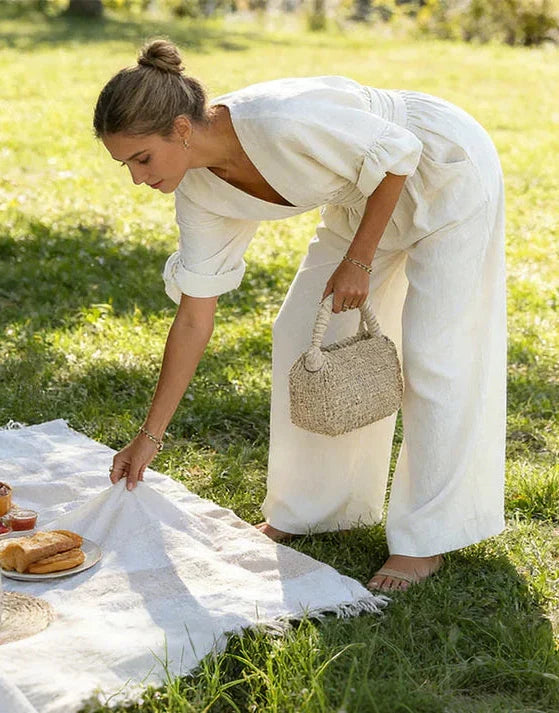 MONICA | ELEGANTE TUTA A GAMBA LARGA CON SCOLLO A V